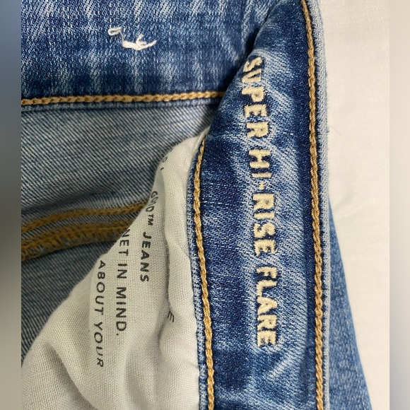 American Eagle Super Hi-Rise Flare Distressed Jeans - Picture 2 of 5